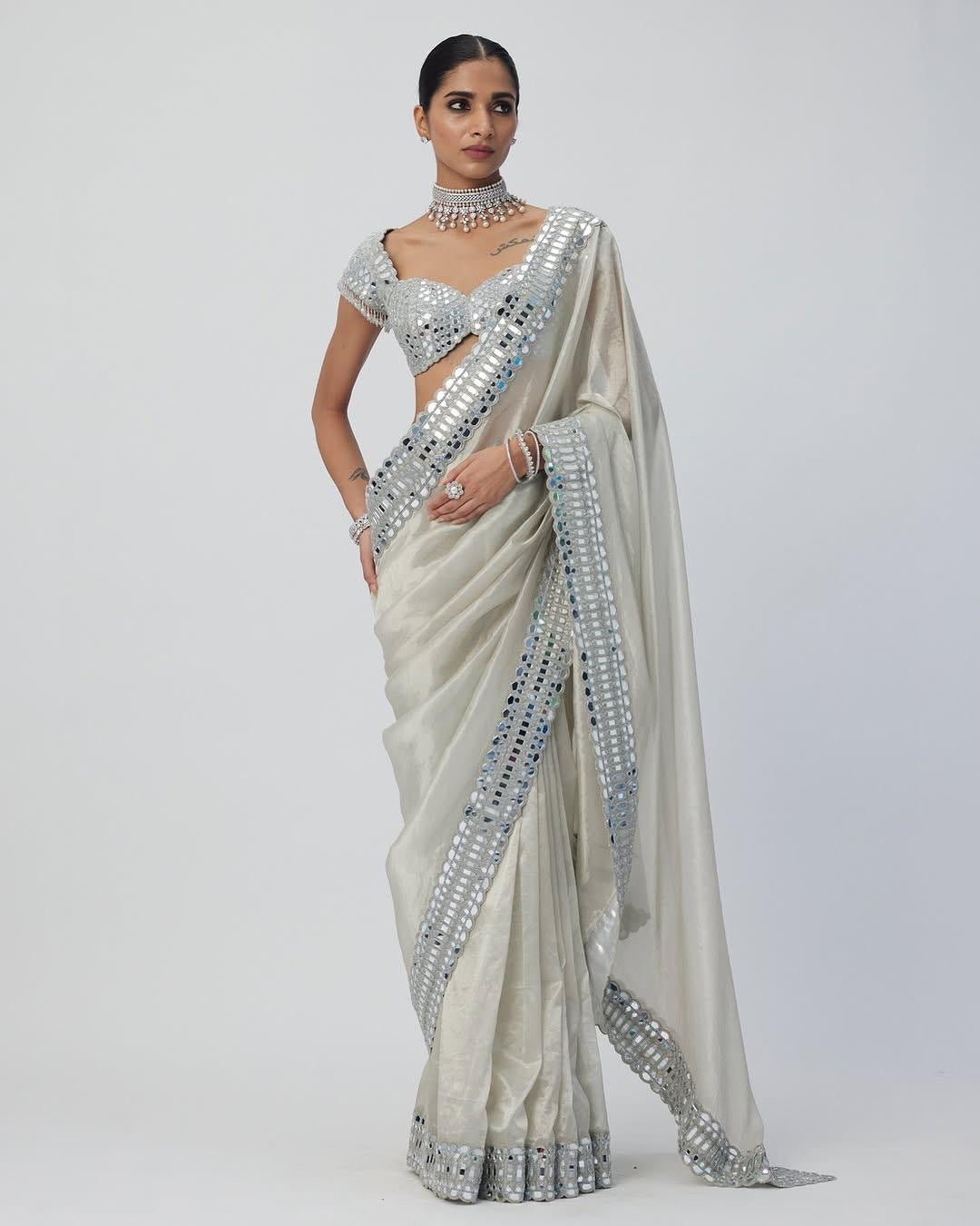 Satin Organza saree which is embedded with real mirror work Embroidery all