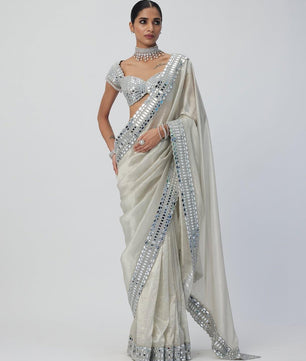 Satin Organza saree which is embedded with real mirror work Embroidery all