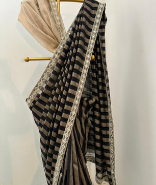 Bridal tissue strips silk saree 
In aesthetic black colour