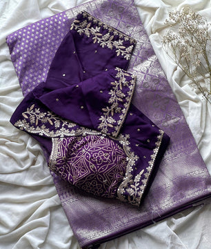 Banarasi Silk Saree Teamed With Red Bandhej Stiched Blouse