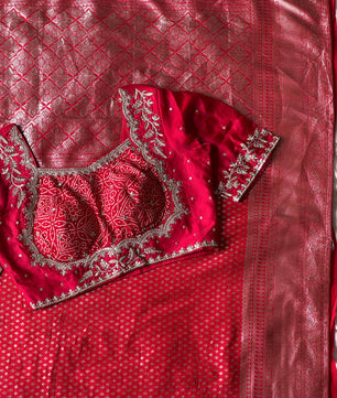 Banarasi Silk Saree Teamed With Red Bandhej Stiched Blouse