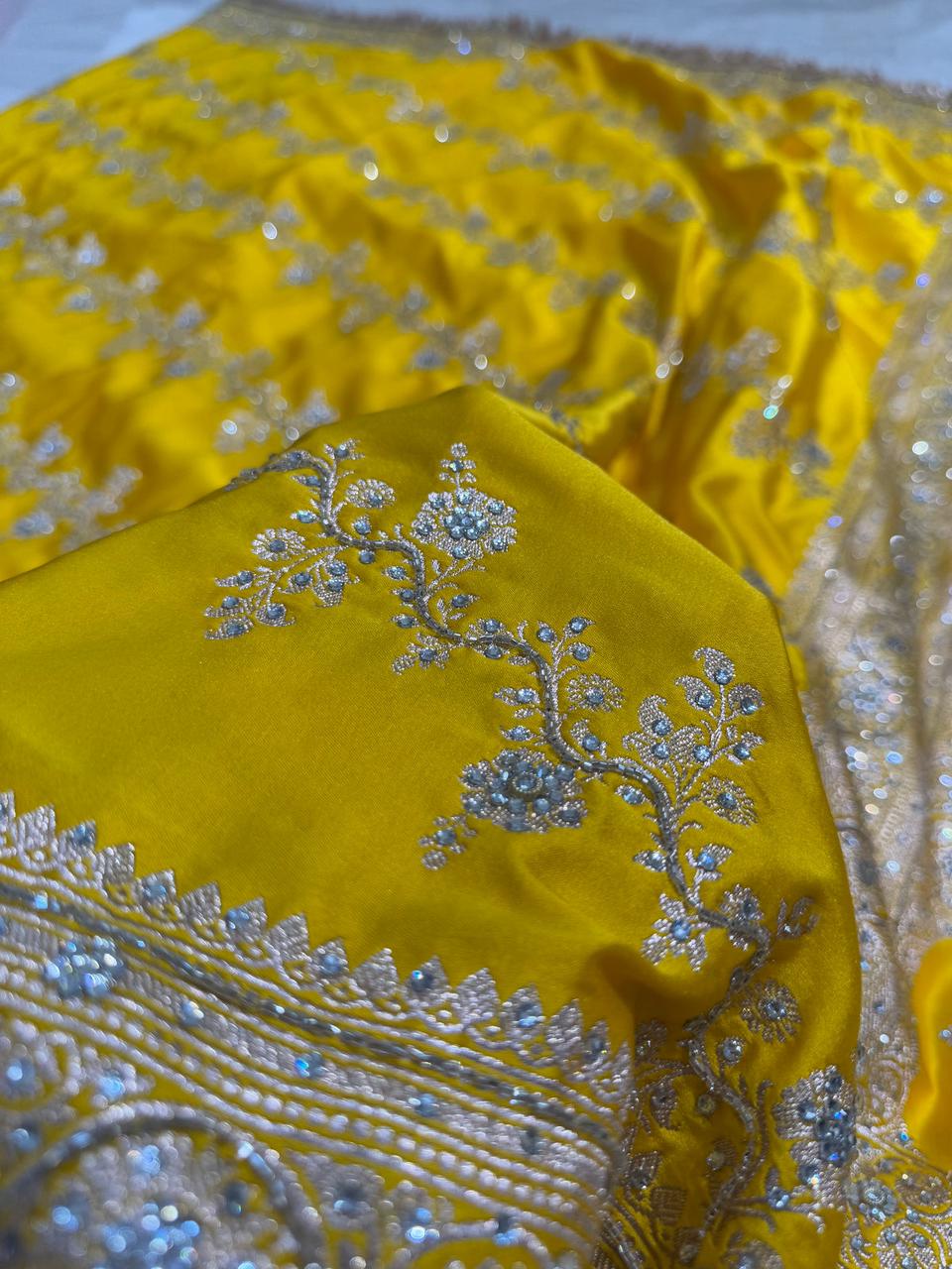 Banarasi Soft Mashru Katan Silk in Marigold Yellow.
Handwoven buta motifs