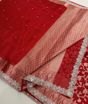 Presenting Banarasi Luxurious Shimmering Tissue Stone Work Saree