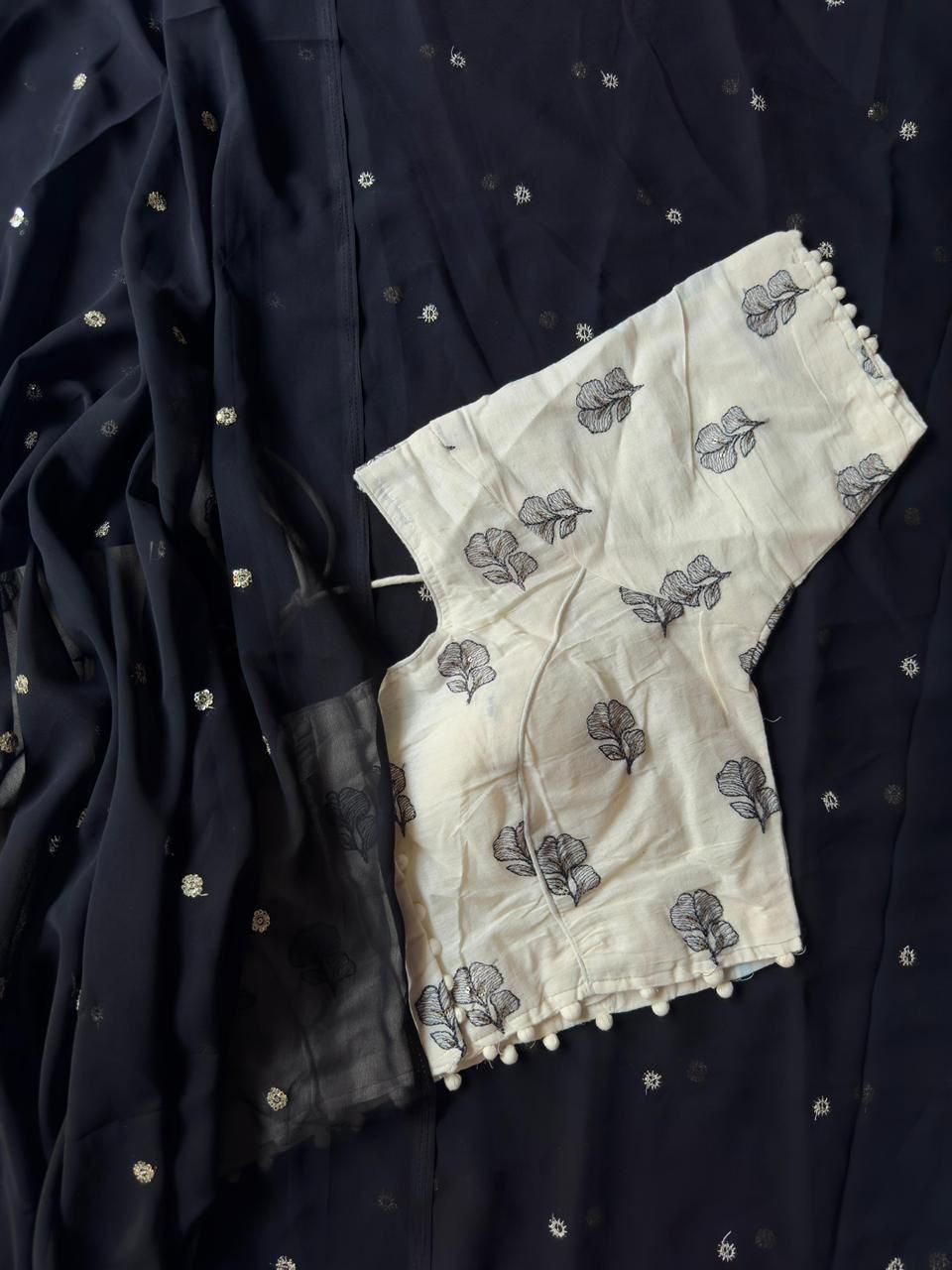 Georgette saree with sequence butties on all over the saree