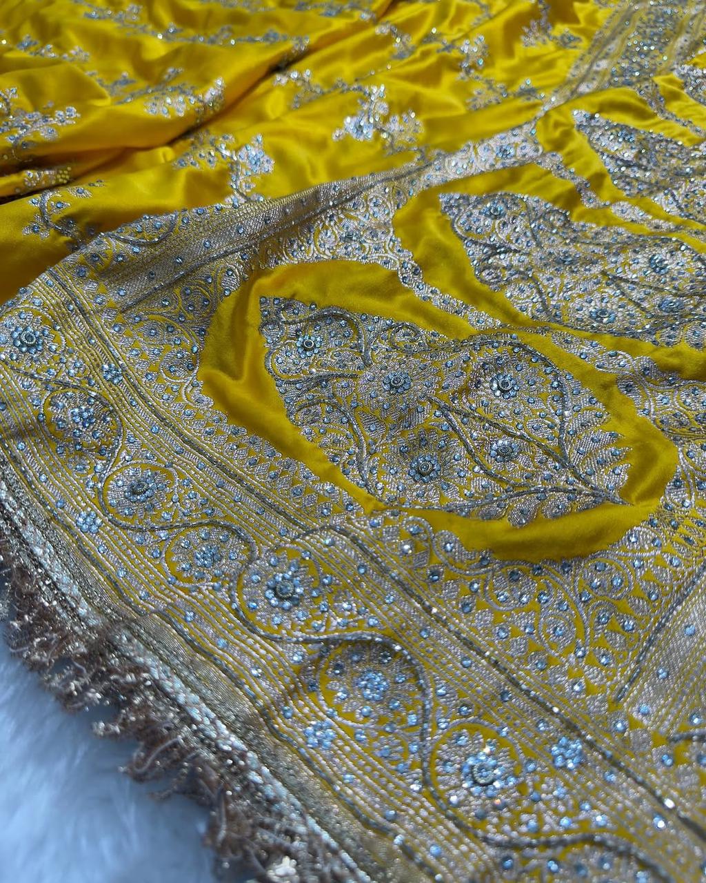Banarasi Soft Mashru Katan Silk in Marigold Yellow.
Handwoven buta motifs