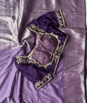 Banarasi Silk Saree Teamed With Red Bandhej Stiched Blouse