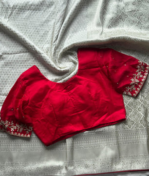 Banarasi Silk White Sari Teamed With Red Bandhej Stiched Blouse