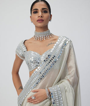 Satin Organza saree which is embedded with real mirror work Embroidery all