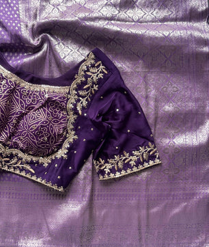 Banarasi Silk Saree Teamed With Red Bandhej Stiched Blouse