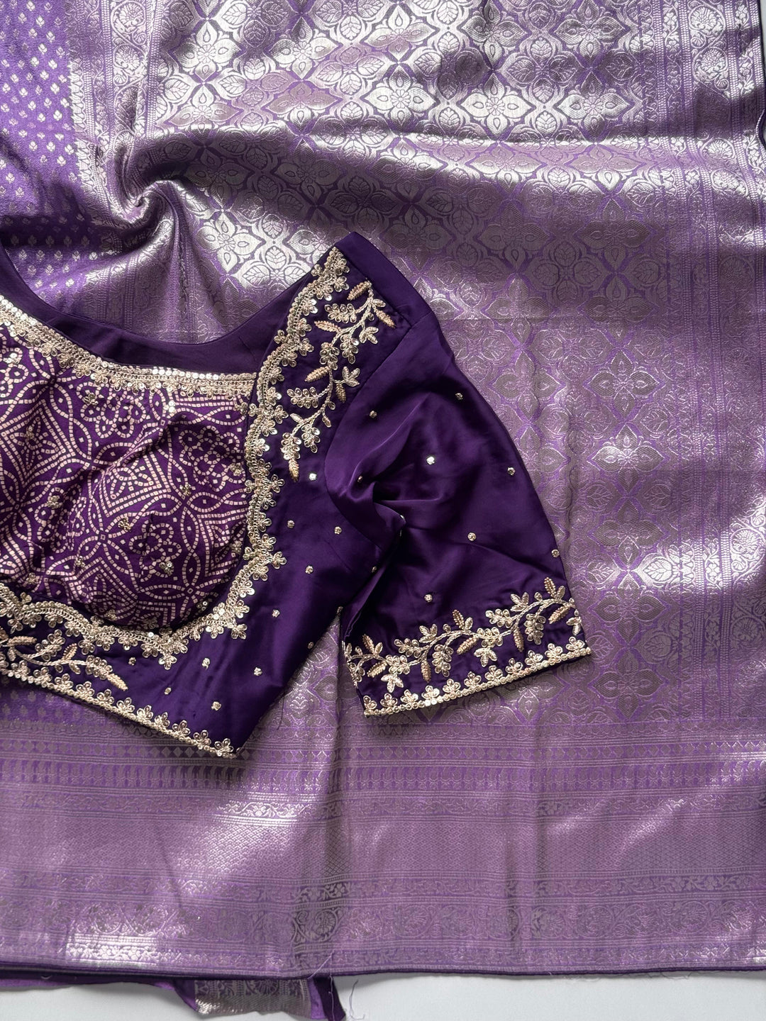 Banarasi Silk Saree Teamed With Red Bandhej Stiched Blouse