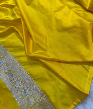 Banarasi Soft Mashru Katan Silk in Marigold Yellow.
Handwoven buta motifs