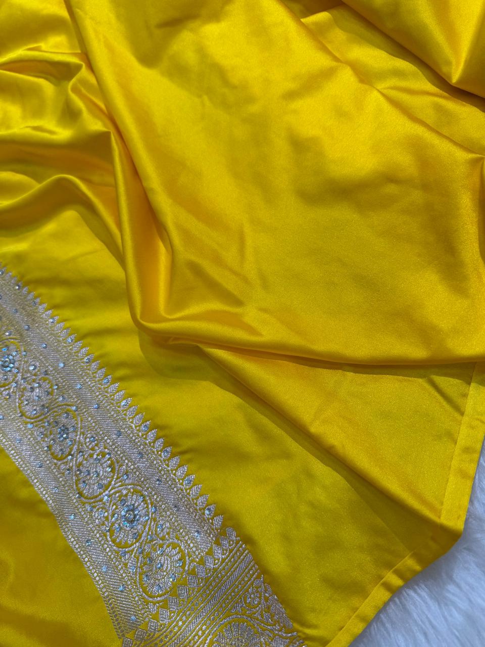 Banarasi Soft Mashru Katan Silk in Marigold Yellow.
Handwoven buta motifs