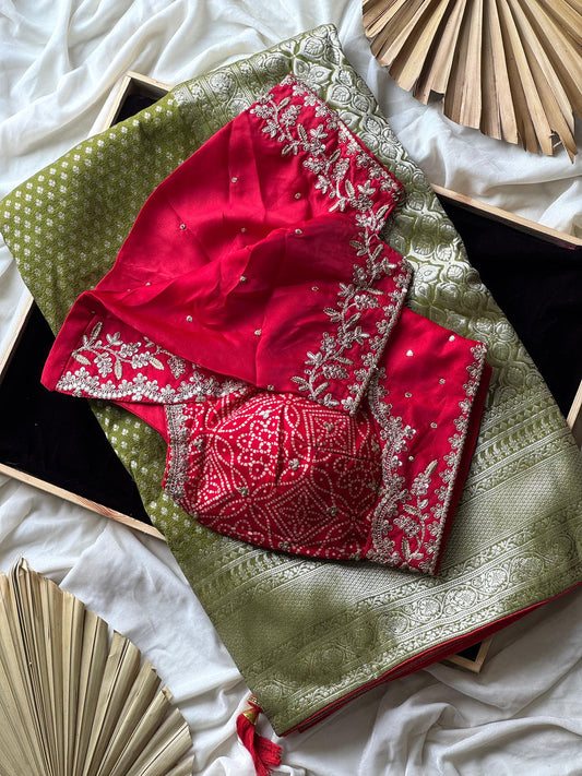 Banarasi Silk Saree In Green Teamed With Red Bandhej Stiched Blouse